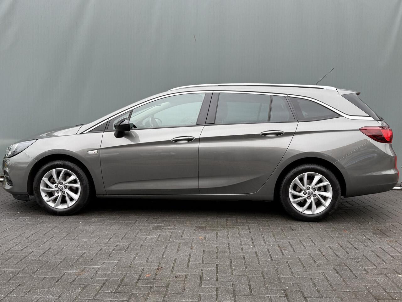 Opel ASTRA Sports Tourer BWJ 2021 1.2 131 PK Business Elegance FULL LED | HALF LEDER | CAMERA | STOELVERW. | STUURVERW. | CARPLAY + ANDROID | NAVI | CLIMA | CRUISE | DAB | LMV | PDC