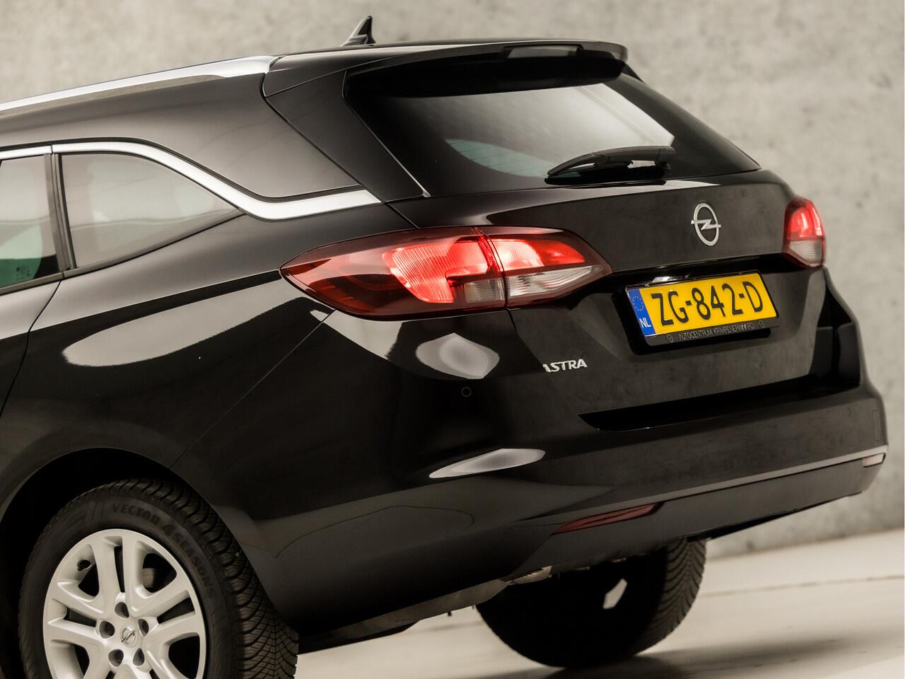 Opel ASTRA Sports Tourer 1.0 Turbo Sport (APPLE CARPLAY, GROOT NAVI, CLIMATE, SPORTSTOELEN, CRUISE, PARKEERSENSOREN, GETINT GLAS, LM VELGEN, NIEUWSTAAT)