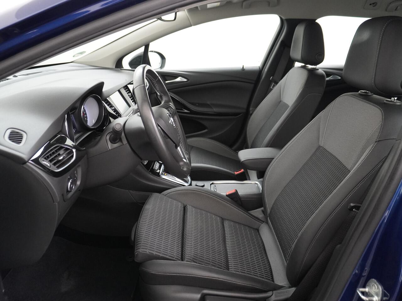 Opel ASTRA Sports Tourer 1.4T 145pk Navi Camera Lane-dep. Keyless 1/2Leer CruiseControl Led Bluetooth Pdc Apple/Android Aut.Verlichting Isofix Elek.Ramen Ecc Tel. Usb 16''LM Business Elegance