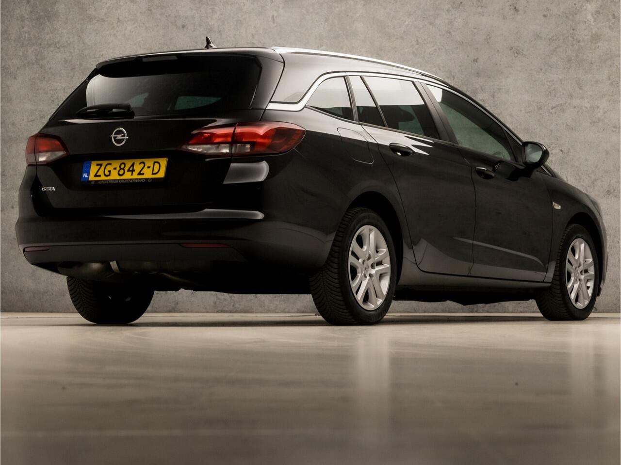Opel ASTRA Sports Tourer 1.0 Turbo Sport (APPLE CARPLAY, GROOT NAVI, CLIMATE, SPORTSTOELEN, CRUISE, PARKEERSENSOREN, GETINT GLAS, LM VELGEN, NIEUWSTAAT)