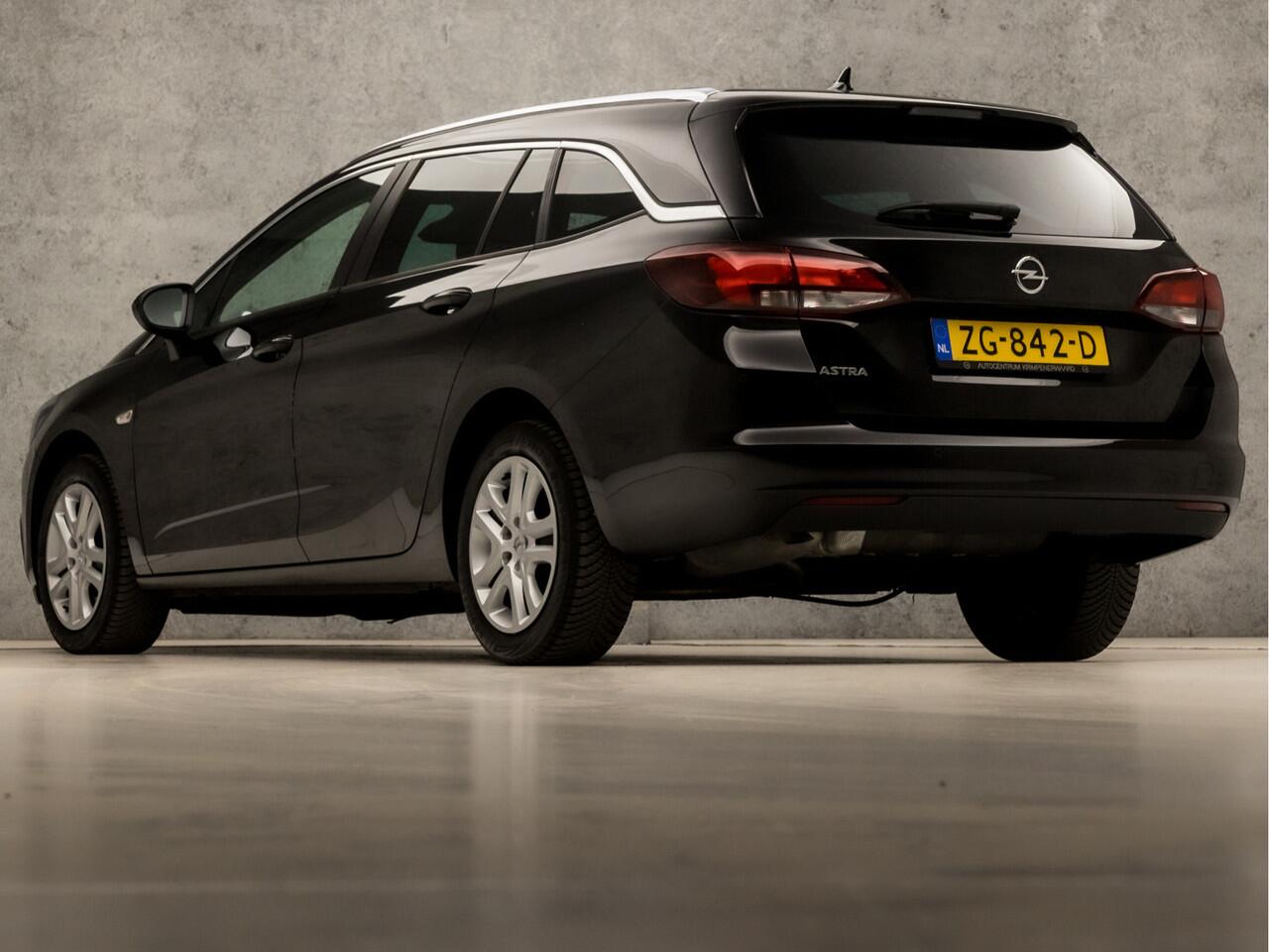 Opel ASTRA Sports Tourer 1.0 Turbo Sport (APPLE CARPLAY, GROOT NAVI, CLIMATE, SPORTSTOELEN, CRUISE, PARKEERSENSOREN, GETINT GLAS, LM VELGEN, NIEUWSTAAT)