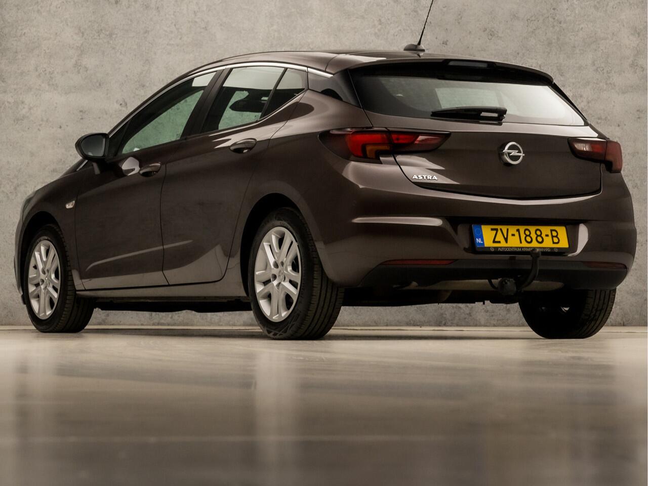 Opel ASTRA 1.4 Turbo Sport 150Pk Automaat (APPLE CARPLAY, GROOT NAVI, CLIMATE, LM VELGEN, SPORTSTOELEN, TREKHAAK, PARKEERSENSOREN, NIEUWE APK, NIEUWSTAAT)