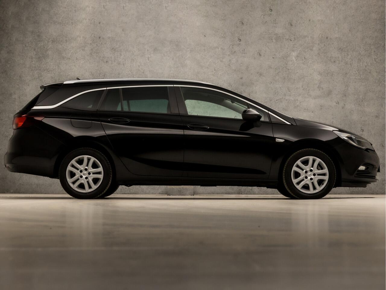 Opel ASTRA Sports Tourer 1.0 Turbo Sport (APPLE CARPLAY, GROOT NAVI, CLIMATE, SPORTSTOELEN, CRUISE, PARKEERSENSOREN, GETINT GLAS, LM VELGEN, NIEUWSTAAT)