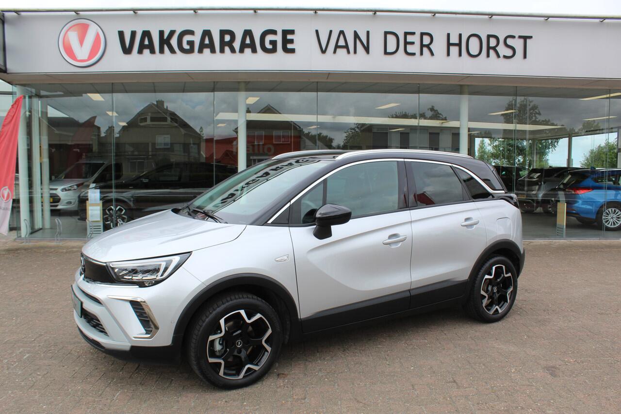 Opel Crossland 1.2-110pk Turbo 'Elegance'. Mooie en luxe hoogzitter met weinig km's ! Volautm. airco dual, cruise control, camera, comfortstoelen, metallic lak, LM wielen, navigatie, telefoonvoorb., lane- en side assist, parkeersensoren v+a, LED verlichting etc.