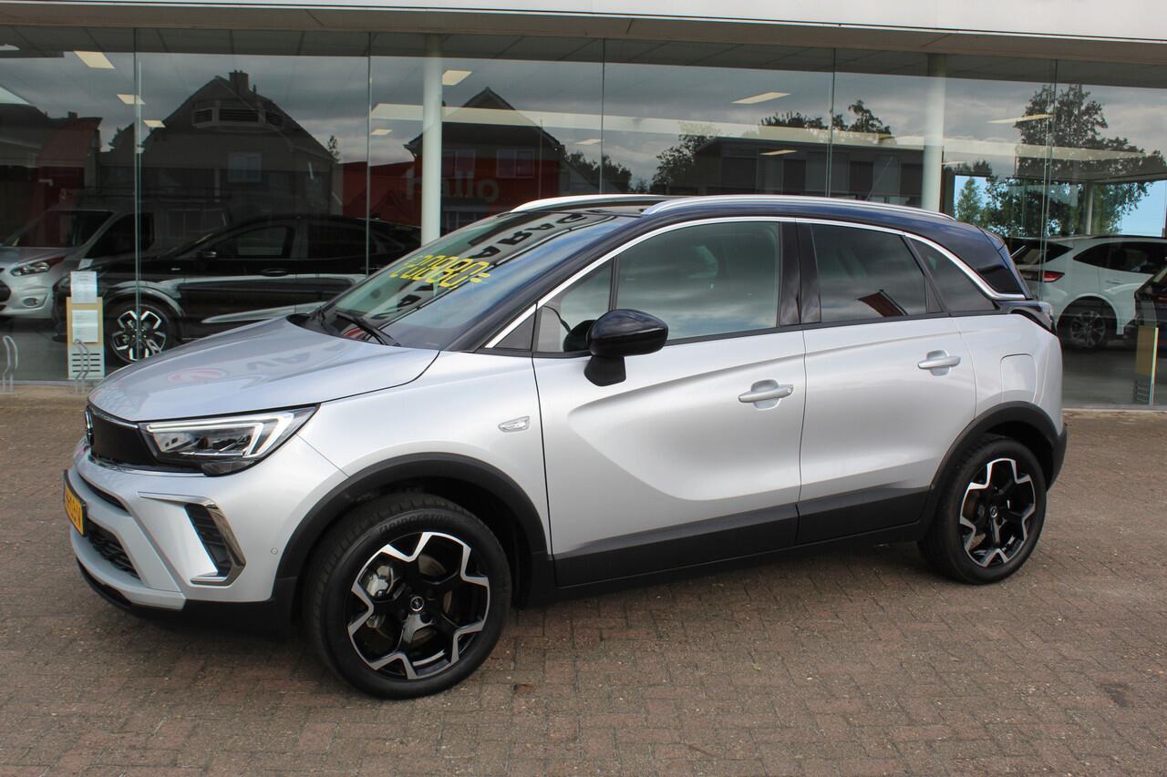 Opel Crossland 1.2-110pk Turbo 'Elegance'. Mooie en luxe hoogzitter met weinig km's ! Volautm. airco dual, cruise control, camera, comfortstoelen, metallic lak, LM wielen, navigatie, telefoonvoorb., lane- en side assist, parkeersensoren v+a, LED verlichting etc.