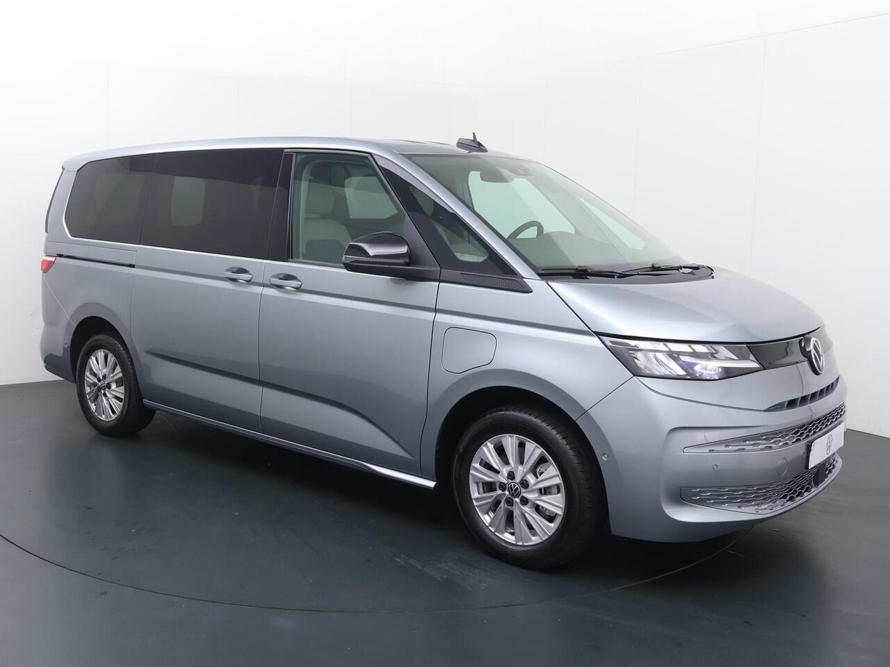 Volkswagen MULTIVAN Bedrijfswagens Economy Business L2 1.5 eHybrid EU6 180 kW (245pk) | Bestelwagen toegestaan voor ALLE ZERO Emissie Milieu-zones M1-Kenteken | Schot laadruimte achter voorstoelen | Houten Laadvloer | Prijs excl. BTW