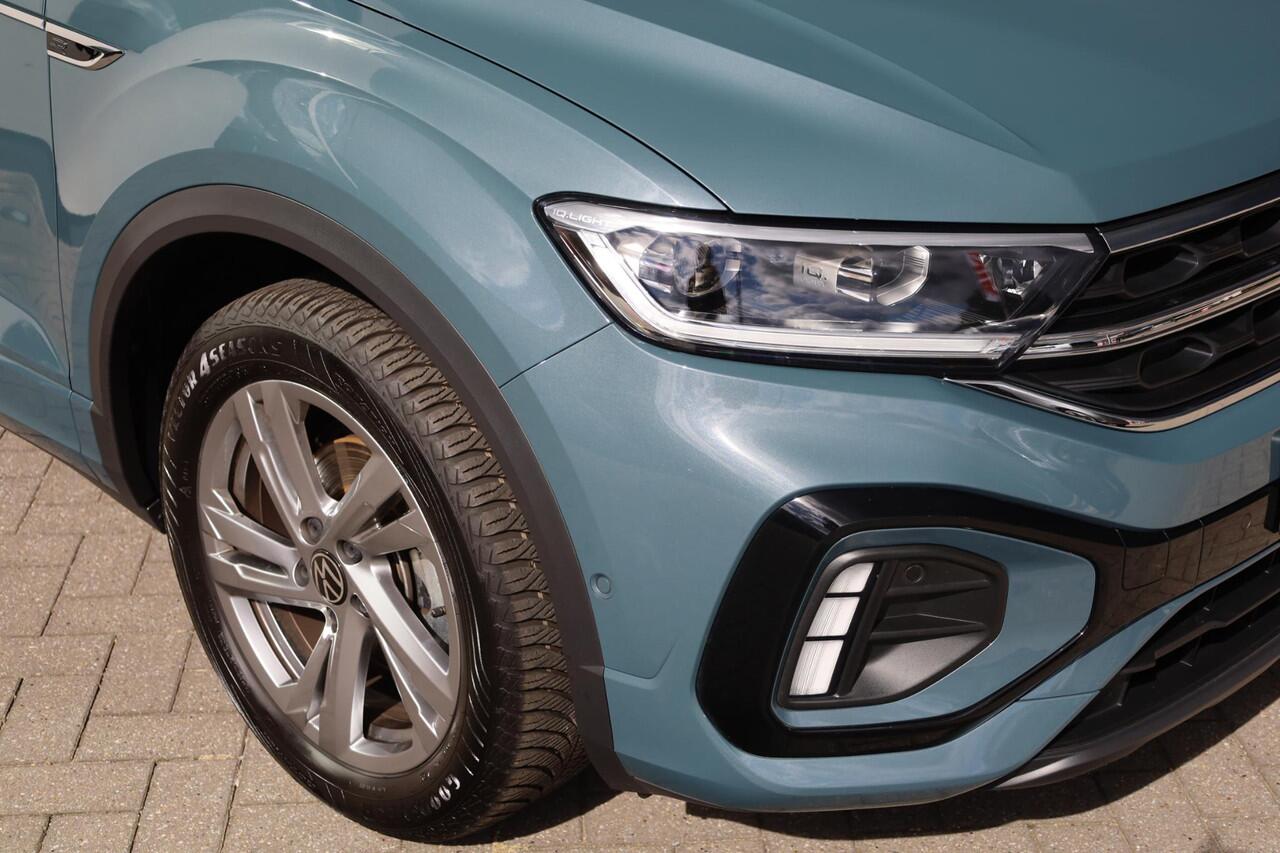 Volkswagen T-Roc 1.5 TSI R-Line afneembare trekhaak achteruitrijcamera two one zwart dak ergo stoel verlengbare zitting & kantelbaar & stoelverwarming privacy glas LED PLUS navigatie vrij geschakeld draadloos laden & carplay / android auto 4 seizoenen banden etc