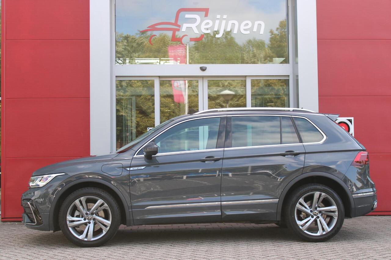 Volkswagen TIGUAN 1.4 TSI 245PK eHybrid R-LINE BUSINESS + | BEKLEDING LEDER VIENNA | PANORAMISCH SCHUIF/KANTEL DAK | ELEKTRISCH WEGKLAPENBARE TREKHAAK | R-LINE INTERIEUR/EXTERIEUR | VERWARMBARE VOORSTOELEN/STUUR | ELEKTRISCH BEDIENBARE VOORSTOELEN MET GEHEUGEN FUNCTIE | AK