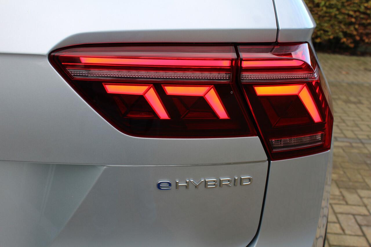 Volkswagen TIGUAN 1.4 TSI eHybrid R-Line Business 245 pk | Incl. 12 maanden Garantie | Panorama dak | Stoel/stuurverwarming | 360* Camera | Elektrisch verstelbare stoelen met memory | Achterbank verwarmd | Keyless enry/start | Adaptieve cruise | Lane assist | IQ.Lights | D