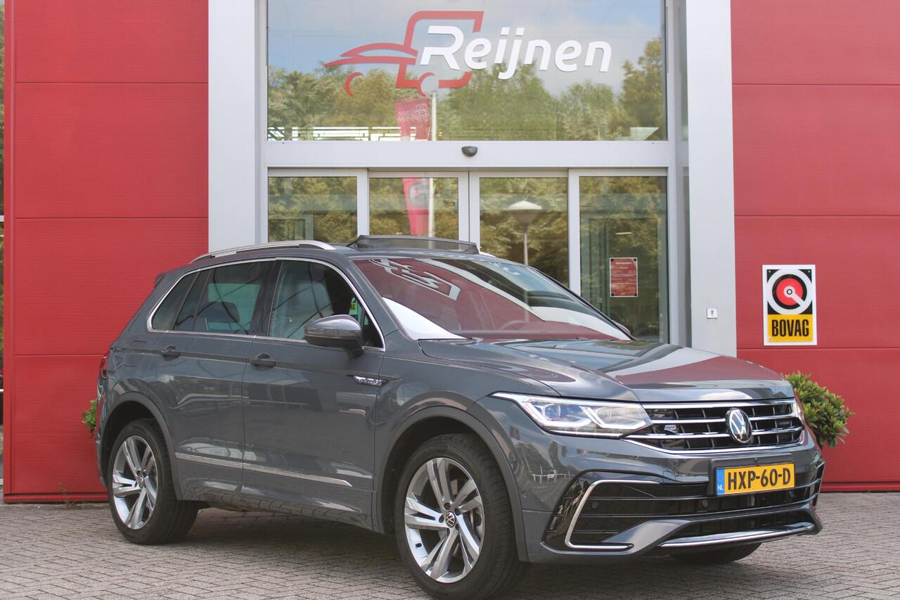 Volkswagen TIGUAN 1.4 TSI 245PK eHybrid R-LINE BUSINESS + | BEKLEDING LEDER VIENNA | PANORAMISCH SCHUIF/KANTEL DAK | ELEKTRISCH WEGKLAPENBARE TREKHAAK | R-LINE INTERIEUR/EXTERIEUR | VERWARMBARE VOORSTOELEN/STUUR | ELEKTRISCH BEDIENBARE VOORSTOELEN MET GEHEUGEN FUNCTIE | AK