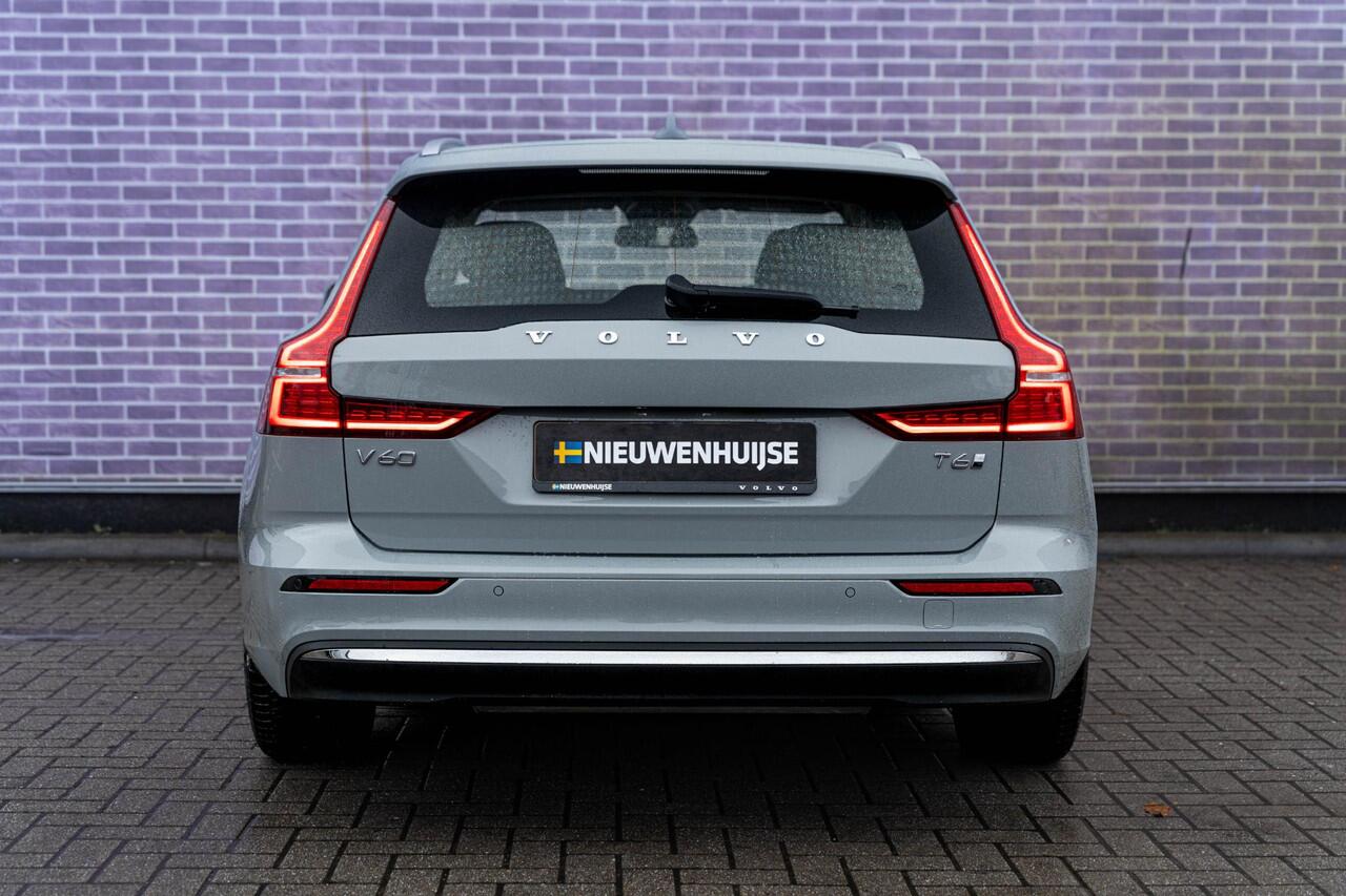 Volvo V60 T6 Plug-in hybrid AWD Essential Bright | Trekhaak | Lederen bekleding | 19" velgen | Google Maps navigatie | Apple Carplay / Android Auto | LED koplampen |